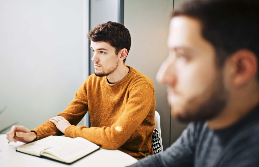 Two people listening