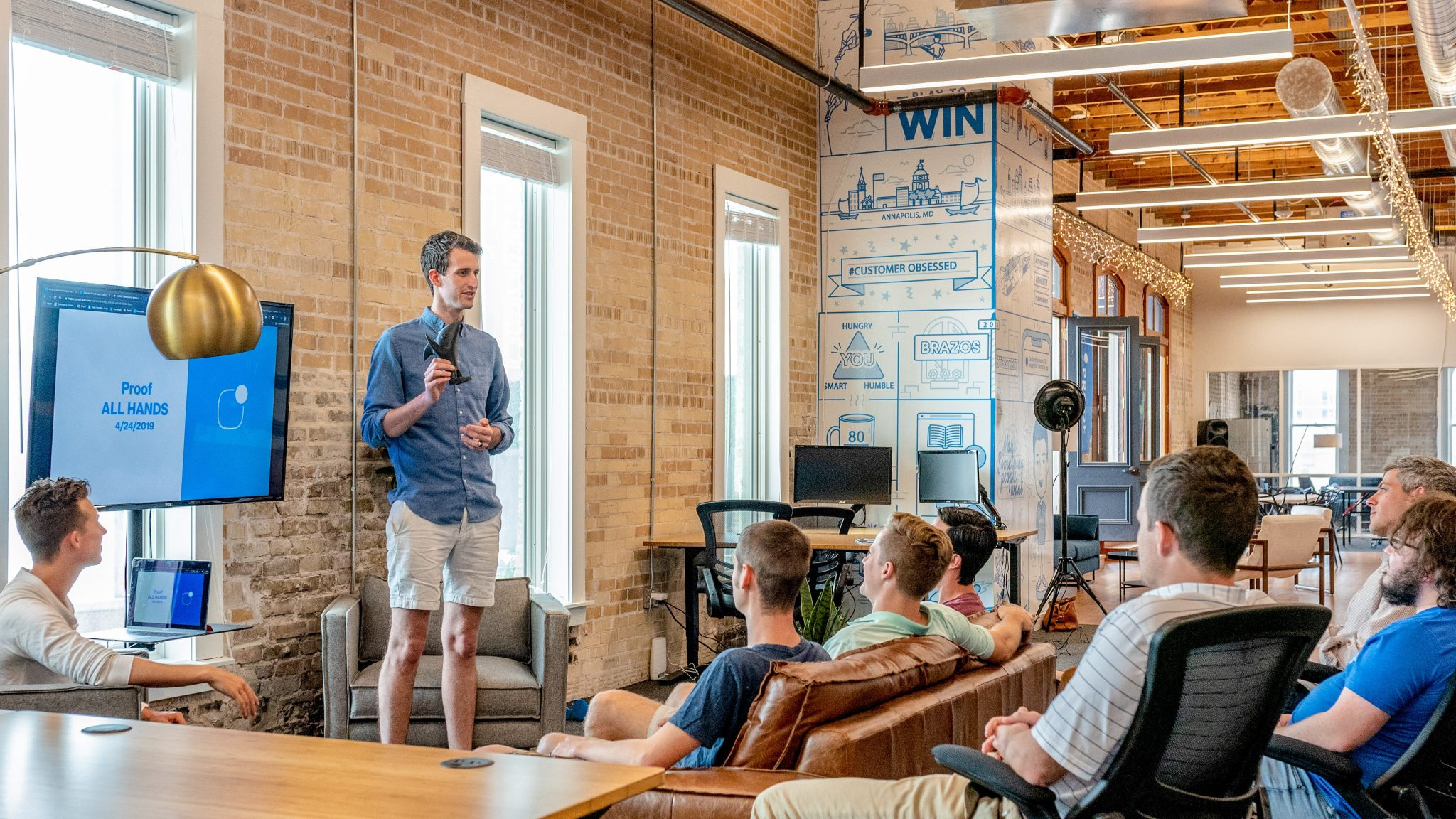 small group of people watching a presentation