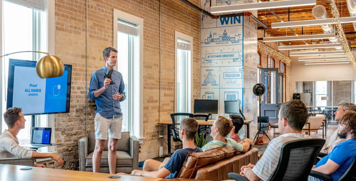 small group of people watching a presentation