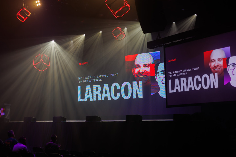 A stage with a large screen displaying 