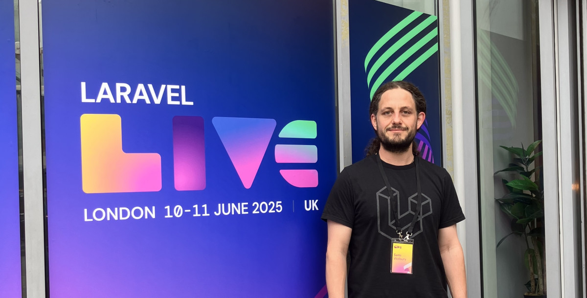 A developer standing outside the entrance to Laravel Live conference